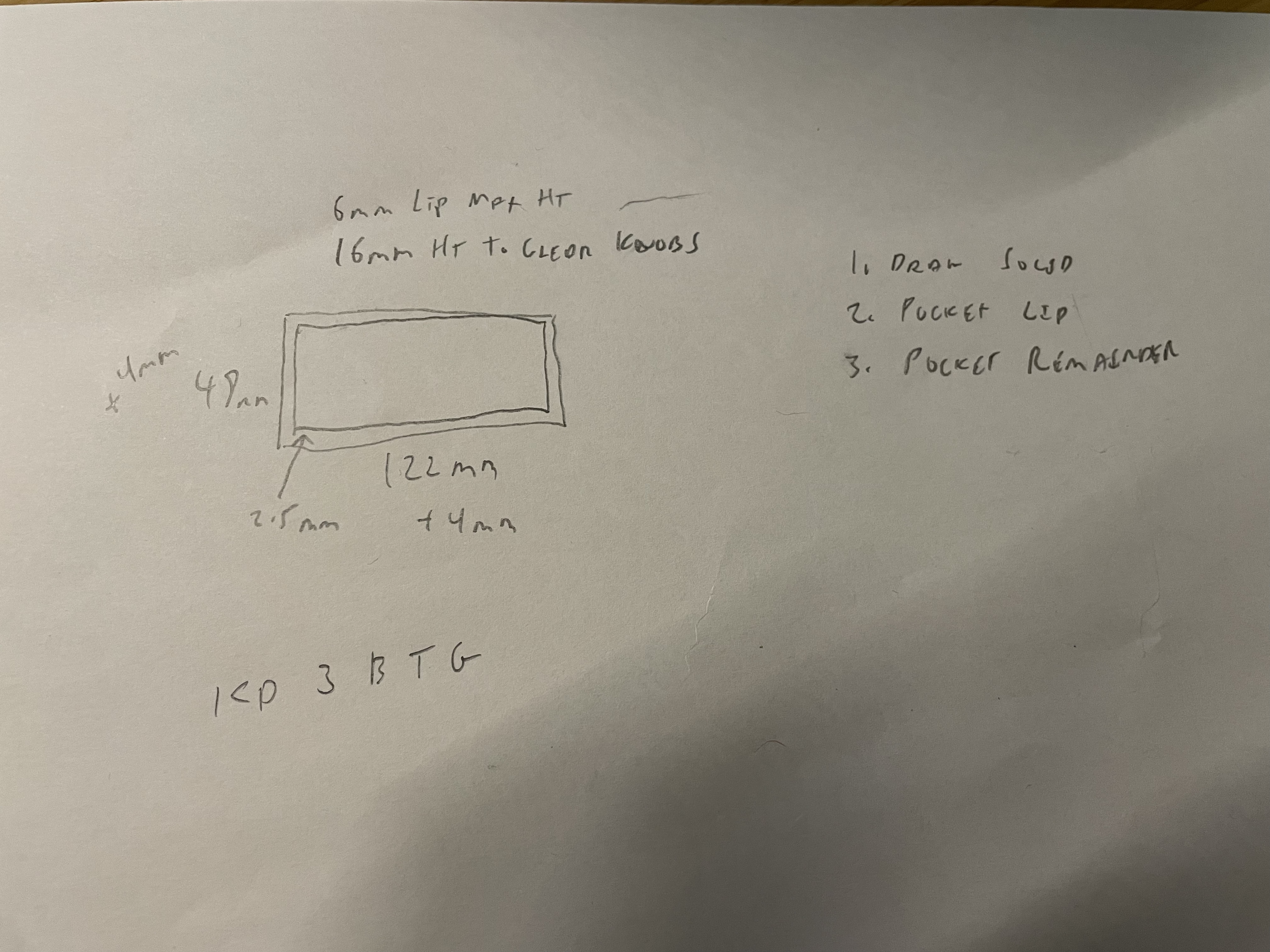 A paper and pencil sketch depicting two concentric rectangles, several measurements and a list of three steps on building it in FreeCAD.