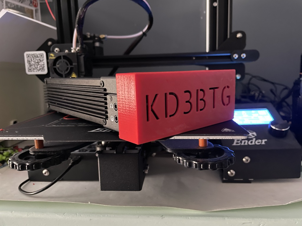 The final product fitted to a Xiegu G90. The front face is covered by a red box with my call sign KD3BTG stenciled across the front.